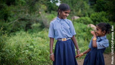Two indian sisters in school uniform